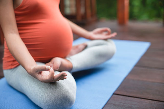 Learn how yoga can improve your fertility with Dr. Cori, health coach for working moms